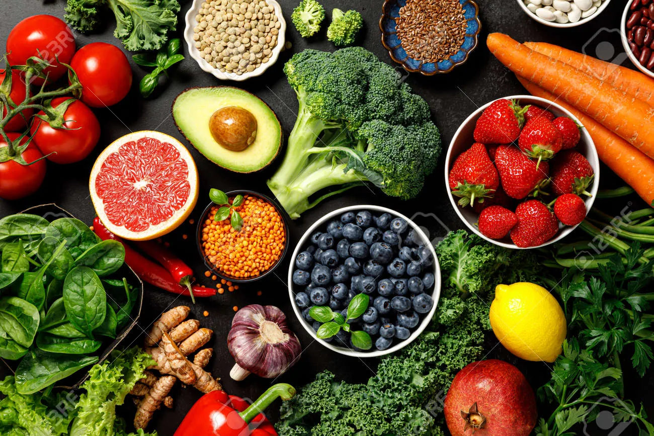 Hands arranging bowls with grains and vegetables